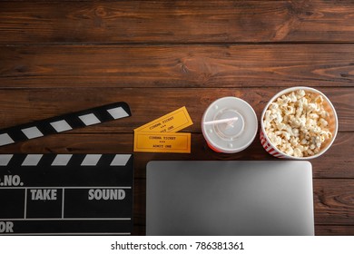 Composition With Laptop, Movie Tickets And Clapboard On Wooden Background, Top View