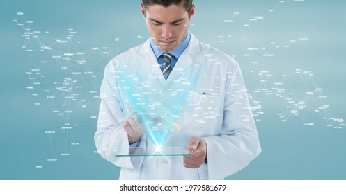 Composition Of Male Doctor Holding Interactive Screen With Medical Data Processing. Global Online Medicine And Technology Concept Digitally Generated Image.