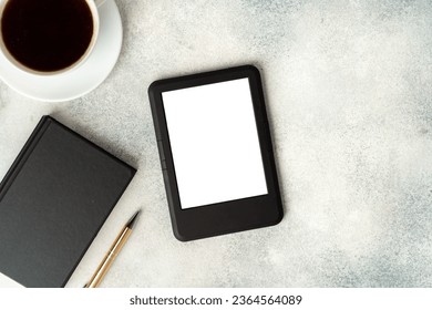 Composition with modern e-book reader, hardcover book and cup of coffee on table - Shutterstock ID 2364564089