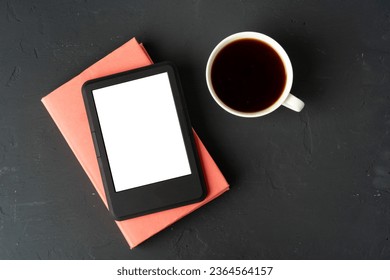 Composition with modern e-book reader, hardcover book and cup of coffee on table - Shutterstock ID 2364564157