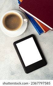 Composition with modern e-book reader, hardcover book and cup of coffee on table - Shutterstock ID 2367797585