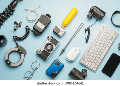 Composition of modern photographer's equipment and computer keyboard on color background - Shutterstock ID 1984164641