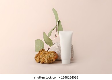 Composition from the natural materials and cosmetics tube near it.Copy space for text or design.Can be used as advertising banner.Pastel colors.Mockup concept. - Shutterstock ID 1848184018