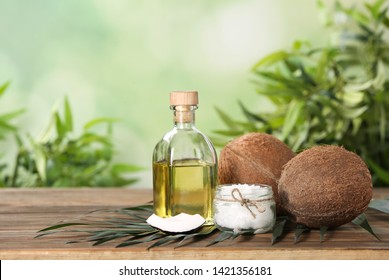 Composition with natural organic coconut oil on wooden table. Space for text - Shutterstock ID 1421356181