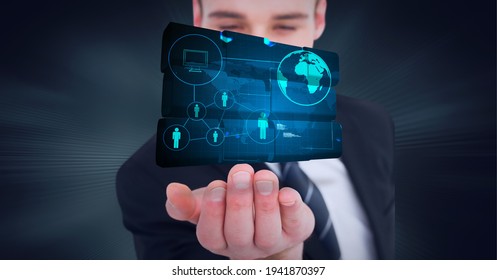 Composition of network of digital icons with globe on digital screen over hand of businessman. global technology and digital interface concept digitally generated image.