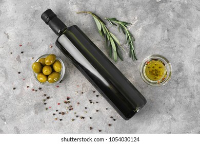 Composition With Olive Oil In Bottle On Table, Top View