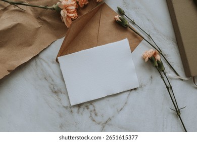 The composition on a flat surface with empty cards and flowers, a model for visualization in space.