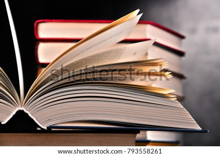 Composition with open book on the table.