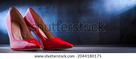 Composition with a pair of women's shoes.