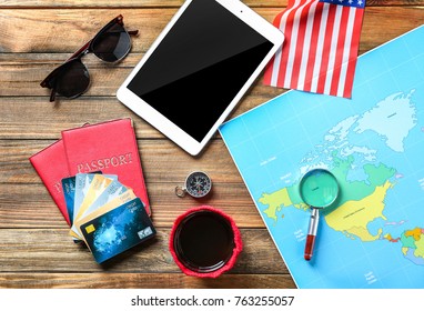 Composition with passports, credit cards and world map on wooden background - Powered by Shutterstock