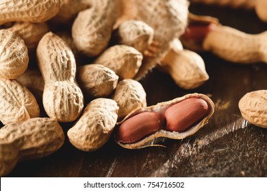 Composition of peanuts serving to make oil, peanut butter. Great for healthy and dietary nutrition. Concept of: condiments, dried fruit, food.