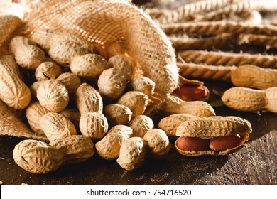 Composition of peanuts serving to make oil, peanut butter. Great for healthy and dietary nutrition. Concept of: condiments, dried fruit, food.