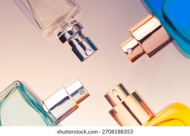 A composition of perfume atomizers, flat lay, top view