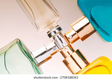 A composition of perfume atomizers, flat lay, top view