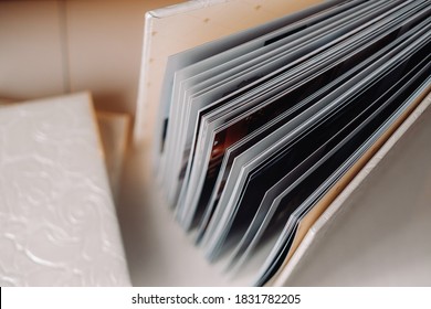 Composition Of Photo Books In Genuine White Leather . Fragment Of A Photobook Binding