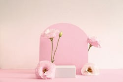 Composition With Plaster Podium And Beautiful Eustoma Flowers On Pink Background