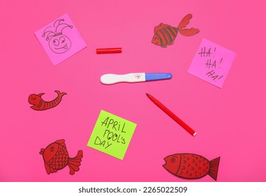 Composition with positive pregnancy test, felt-tip pen and paper decor on color background. April Fool's Day celebration - Powered by Shutterstock
