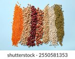 Composition with raw legumes on color background