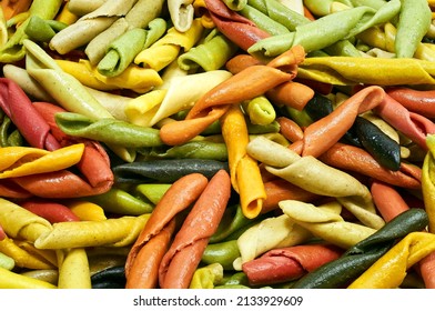 Composition Of Raw Pasta Uncooked Tricolore Fusilli, Pasta Twist Shape. Close Up And Selective Focus On Colorful Fusilli Pasta.