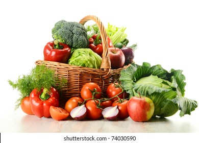 Composition with raw vegetables and wicker basket isolated on white - Shutterstock ID 74030590