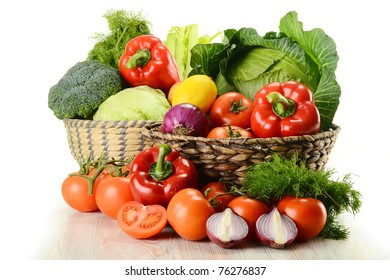 Composition with raw vegetables and wicker basket isolated on white - Shutterstock ID 76276837