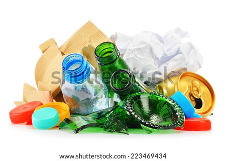 Composition with recyclable garbage consisting of glass, plastic, metal and paper isolated on white background