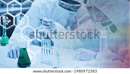 Composition of scientists in ppe suits with test tubes working in laboratory and chemical compounds. research and science concept digitally generated image.