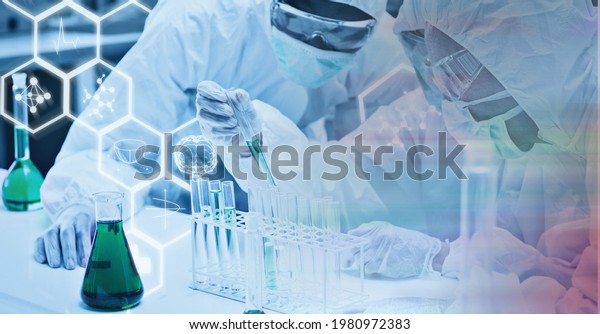 Composition of scientists in ppe suits\
with test tubes working in laboratory and chemical compounds.\
research and science concept digitally generated\
image.