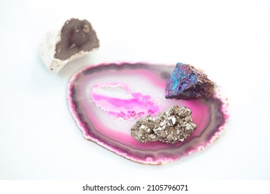 Composition of semi precious stones  on bright background. Collection of beautiful stones: agate, pyrite, chalcopyrite. Home decoration, geology hobby.  - Shutterstock ID 2105796071