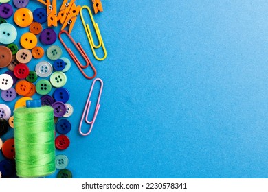 Composition of sewing equipment on blue background with copy space. National craft month, sewing, clothes and needlework concept. - Powered by Shutterstock