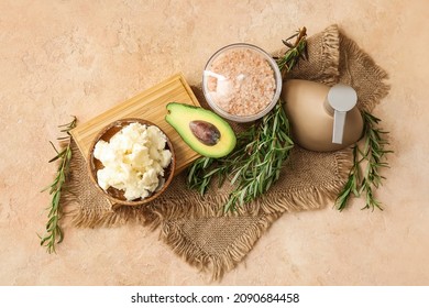 Composition With Shea Butter, Avocado, Herbs And Bath Supplies On Color Background