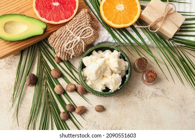 Composition With Shea Butter, Bath Supplies, Avocado And Fruits On Light Background