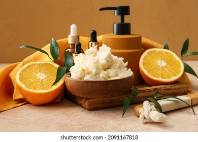 Composition with shea butter, orange fruits and cosmetic products on color background - Shutterstock ID 2091167818