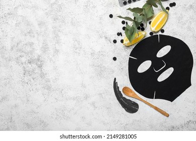 Composition With Sheet Facial Mask, Activated Carbon Pills And Lemon On Light Background