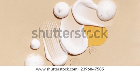composition of smears of cream texture on a beige background