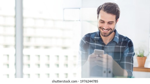 Composition of smiling man using smartphone in office with white overlay. global networking, business and technology concept digitally generated image. - Powered by Shutterstock