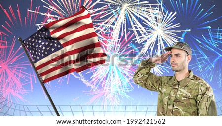 Composition of soldier saluting with fireworks against american flag. united states of america patriotism and independence concept digitally generated image.
