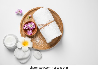 Composition with spa stones on white background, top view