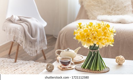 Composition With Spring Flowers In A Cozy Living Room Interior . The Concept Of Decor And Comfort.