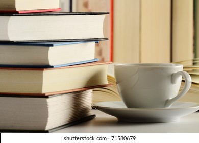 Composition with stack of books on table