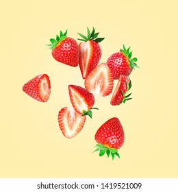 The composition of strawberries on a colored background. Cut strawberries into pieces with copy space. Fresh natural strawberry isolated. Strawberry slices flying in the air - Shutterstock ID 1419521009
