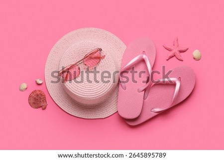 Composition with stylish flip-flops, sunglasses and hat on pink background