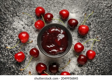 Composition with sweet cherry jam and sugar on dark background - Shutterstock ID 2049936845