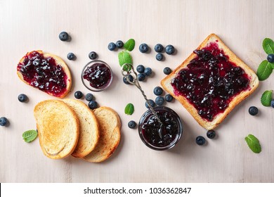 Composition with sweet jam and toasts on wooden background - Powered by Shutterstock