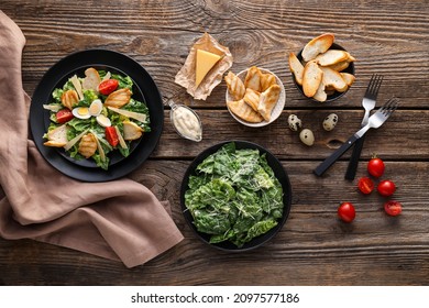 Composition with tasty Caesar salad and sauce on wooden background - Powered by Shutterstock