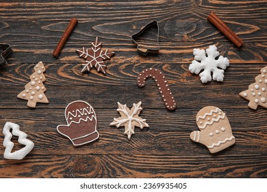 Composition with tasty Christmas cookies, decorations and cutters on wooden background - Powered by Shutterstock