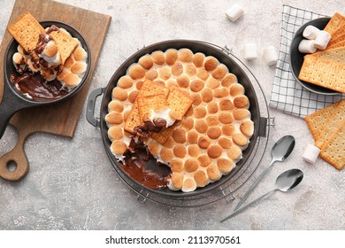 Composition with tasty S'mores dip on grey background