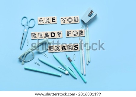 Composition with text ARE YOU READY FOR EXAMS and different stationery on color background