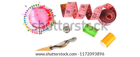 Composition with threads and sewing accessories isolated on white background. Sewing pattern. Flat lay, top view. Wide photo.