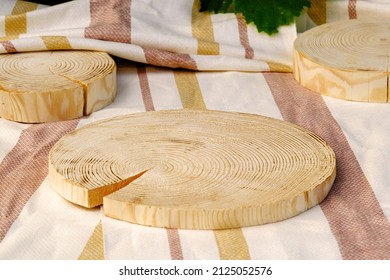 composition three wooden podiums on textile towel for presentation of various products, rural showcase - Shutterstock ID 2125052576